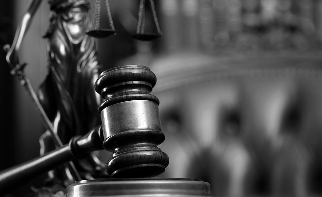 stock image of scales of justice and gavel
